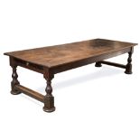 A LARGE 19TH CENTURY OAK REFECTORY TABLE with turned supports to either end united by stretchers,