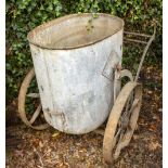 A WROUGHT IRON AND GALVANISED WATER BARROW approximately 130cm long overall