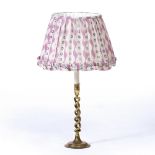 A BRASS BARLEY TWIST TABLE LAMP with spreading circular base and patterned cotton shade, 64cm high