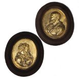 A PAIR OF GILT OVAL PORTRAIT PLAQUES set in oval brown kid leather covered frames, each frame 19cm x