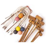 A COLLECTION OF VARIOUS CROQUET MALLETS wrought iron hoops and balls, the mallets each approximately