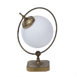 A BRASS TABLE LAMP with central opaque glass sphere and the square base with canted corners, 51cm