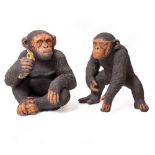 TWO PAINTED COMPOSITE STONE MODELS of chimps, the largest 50cm wide x 51cm high (2)