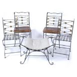 A PAIR OF WROUGHT IRON SIDE CHAIRS with crossed arrow decorated backs and seats with squab cushions,