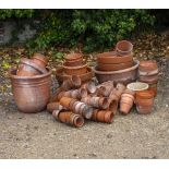 A COLLECTION OF SMALL TO MEDIUM SIZED TERRACOTTA PLANT POTS approximately 80, the largest 40cm