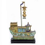 A CHINESE GILT METAL AND CLOISONNE ENAMEL ORNAMENT in the form of a barge with galleried