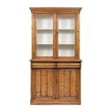 AN EDWARDIAN PINE DRESSER the glazed cupboards above enclosing white painted shelves over two