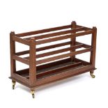 A HARDWOOD LIBRARY CHART OR FOLIO STAND on brass casters, 94cm long x 41cm deep x 62.5cm high