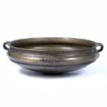 A LARGE BRONZE URULI 19th century South Indian, decorated to one side with two stars and the