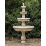 A CARVED MARBLE FOUR TIER FOUNTAIN each of the tiers with gadroon moulded decoration and all