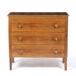 A GORDON RUSSELL LTD., BROADWAY WORKS WALNUT VENEERED CHEST of three long drawers with turned knob