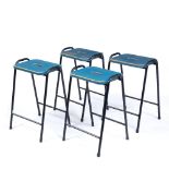 A SET OF FOUR BLACK PAINTED TUBULAR STEEL STOOLS with blue painted wooden seats, 40cm wide x 62cm