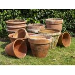 A COLLECTION OF VARIOUS TERRACOTTA FLOWER POTS to include three with Greek key banded decoration,