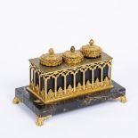 AN EARLY 19TH CENTURY ORMOLU AND MARBLE GOTHIC REVIVAL INK STAND with pierced arcaded decoration,