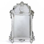 A VENETIAN WALL MIRROR with engraved floral decoration and panelled sides, 77cm wide x 128cm high