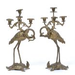 A PAIR OF 18TH CENTURY STYLE CAST BRASS FOUR LIGHT, THREE BRANCH CANDELABRA in the form of cranes