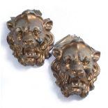 A PAIR OF GILT ZINC ARCHITECTURAL LION MASKS of large size, 40cm wide x approximately 50cm high (2)