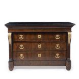 A LOUIS PHILIPPE STYLE BLACK MARBLE TOPPED MAHOGANY COMMODE with four drawers, gilt metal mounts and