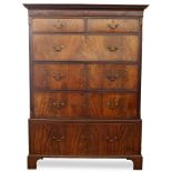 A GEORGE III MAHOGANY HOUSEKEEPERS CHEST ON CHEST with two short and four long deep drawers, all