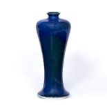 A RUSKIN GREEN AND BLUE GLAZE VASE of shouldered form and roll rim, impressed marks, dated 1909,