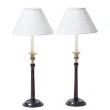 A PAIR OF GEORGIAN STYLE MAHOGANY AND BRASS TABLE LAMPS with fluted columns and turned bases, each