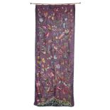 A 19TH CENTURY CREWEL WORK PANEL wools on aubergine linen depicting scrolling flora, exotic birds, a