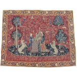 A FRENCH MACHINE MADE TAPESTRY depicting musicians, a unicorn and a lion, 213cm x 272cm