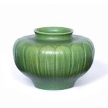 A ROYAL LANCASTRIAN GREEN GLAZE VASE of squat ovoid form and streaked molded exterior, circa