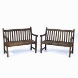 A PAIR OF CHILDREN'S TEAK BENCHES of small size, 72cm wide x 59cm high (2)