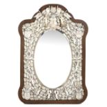 A 19TH CENTURY FRENCH DIEPPE IVORY MOUNTED WALL MIRROR with shaped oak frame and bevelled glass,