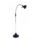 A SERIOUS READER FLOOR STANDING LAMP with gilt stem and spreading circular black painted base, 160cm