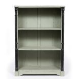 A GREY PAINTED OPEN FRONTED DWARF BOOKCASE with ebonised fluted outset pilaster columns to either