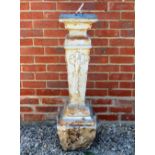 A CAST IRON SUNDIAL BASE with cast aluminium sundial plate and gnomen, 27cm wide x 81cm high