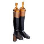 A PAIR OF BLACK AND BROWN LEATHER RIDING BOOTS the leather soles 29.5cm long toe to heel