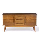 A MID TO LATE 20TH CENTURY TEAK SIDEBOARD with three central drawers flanked by cupboards to
