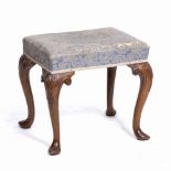 A WALNUT DRESSING TABLE STOOL with carved cabriole legs and overstuffed upholstered seat, 50cm