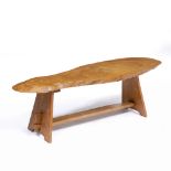 AN ELM LOW TABLE of naturalistic form, 125cm wide x 41cm deep x 41cm high