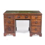 A 19TH CENTURY MAHOGANY PARTNERS DESK with a green leather inset top and seven drawers to either