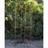 A PAIR OF WROUGHT IRON SQUARE SECTION OBELISKS each surmounted by a ball finial, 32.5cm wide x 228cm