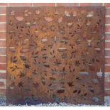 A PIERCED STEEL PANEL depicting autumn leaves, 92cm wide x 91.5cm high