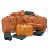 A GRADUATED SET OF THREE ITALIAN LEATHER SUITCASES by Schedoni of Modena, the largest case 77cm wide