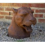 A CAST IRON SCULPTURE depicting the head of a puma, 28cm wide x 49cm deep x 42cm high