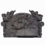 AN ANTIQUE CARVED CONTINENTAL FRAGMENT depicting an angel flying holding a banner, flanked by