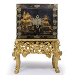 AN 18TH CENTURY CHINESE BRASS MOUNTED CABINET ON STAND the doors to the front decorated with