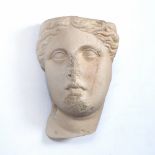 A CAST PLASTER SCULPTURE AFTER THE ANTIQUE of a female head, 30cm high x 16cm wide