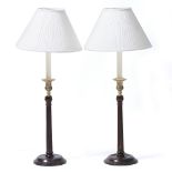 A PAIR OF GEORGIAN STYLE MAHOGANY AND BRASS TABLE LAMPS with fluted columns and turned bases, each