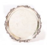 A WHITE METAL SILVER SALVER OR TRAY with scroll and foliate border, stamped 925 and sterling, 24.5cm