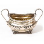 AN EDWARDIAN SILVER SUGAR BASIN with twin scrolling handles, marks for London 1923, approximately