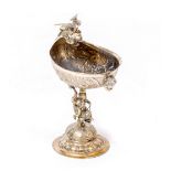 A RENAISSANCE STYLE SILVER LIBATION CUP decorated with a dragon, chased and engraved body and with a