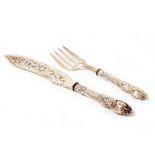 A PAIR OF VICTORIAN SILVER FISH SERVERS with pierced and engraved decoration and loaded handles,